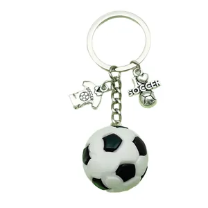 Realistic 3D PVC soccer ball keychain featuring 'I love soccer' and jersey charms