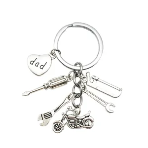 Detailed macro view of silver Father's Day keychain with dad heart and tool charms