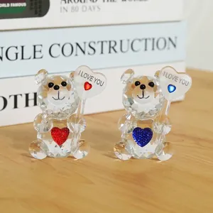 Close-up of two cute crystal bears holding I LOVE YOU hearts for Valentine's