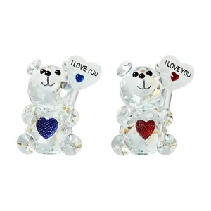 Close-up of crystal bear figurines holding I Love You hearts for Valentine's Day gift