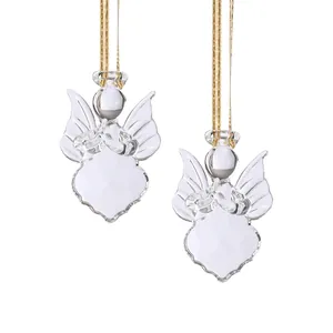 Detailed view of clear faceted crystal angel Christmas ornaments with gold strings.