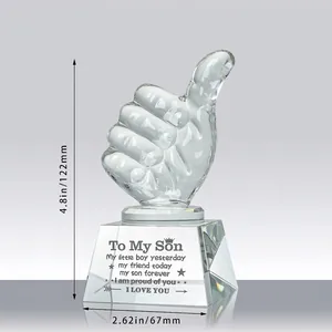 Detailed view of clear thumbs up crystal trophy base with 'To My Son' sweet message engraving