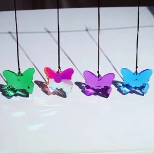 Detailed view of four colorful crystal butterfly suncatchers showing vibrant light refraction