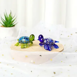 Detail of handcrafted glass miniature sea turtle figurines for desk or aquarium decor