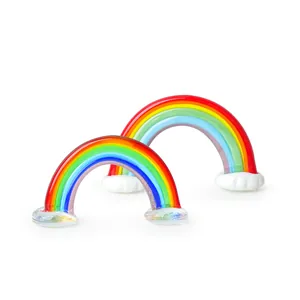 Macro detail view of two colorful glass rainbow ornaments with cloud-like base.