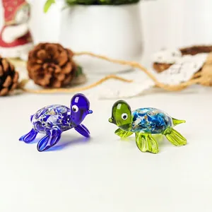 Detailed view of two handcrafted colorful glass sea turtle figurines for micro landscape decor