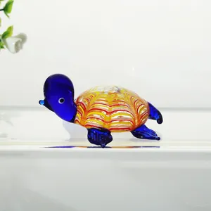 Detailed view of a colorful hand-blown glass turtle figurine for home decor and aquariums.