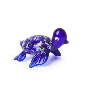 Detailed macro shot of a miniature handcrafted blue glass turtle figurine for home office decor