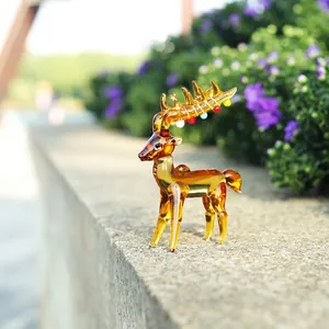 Detail view of a handcrafted translucent amber glass reindeer figurine for Christmas decor