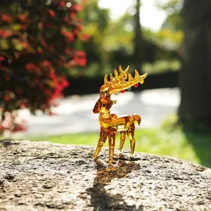 Detail of the amber glass texture of this Christmas reindeer figurine in sunlight