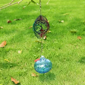 Outdoor garden wind spinner with Tree of Life design and blue speckled glass ball.