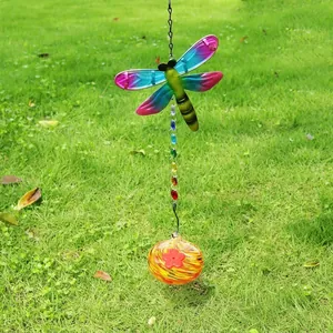 Detailed view of a colorful dragonfly suncatcher featuring crystal beads and a glass ornament