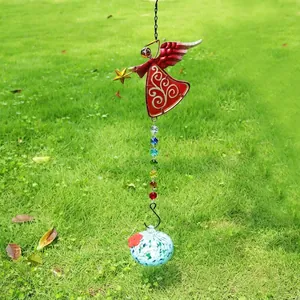 Vibrant angel suncatcher with rainbow crystal beads and blue spotted glass ball detail.