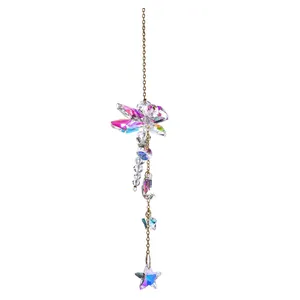 Detailed view of AB color crystal dragonfly suncatcher with star and moon charms