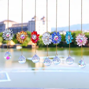 Close-up of vibrant faceted crystal sunflower suncatchers in various colors for garden