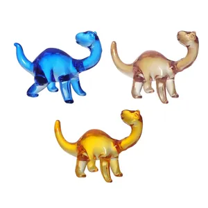 Detailed macro view of three colorful handmade glass dinosaur figurines for home decor