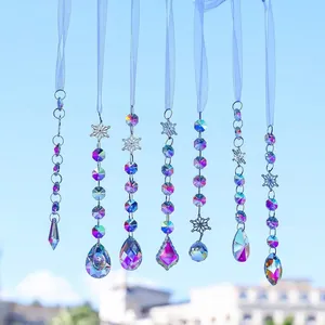 Detailed view of seven iridescent crystal suncatchers with snowflake charms and ribbons.