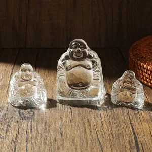Een set van drie transparante kristallen Maitreya Boeddhabeelden voor op tafel