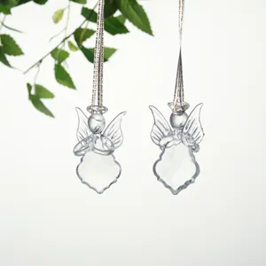 Close-up of transparent crystal angel ornaments hanging for Christmas tree decoration