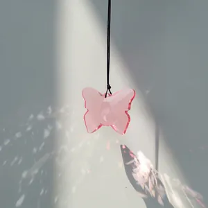 Pink crystal butterfly suncatcher pendant with rainbow light reflections for garden