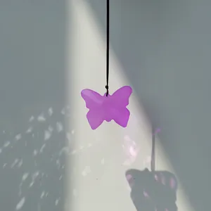 Artistic purple butterfly sun catcher pendant hanging ornament with prismatic light effects
