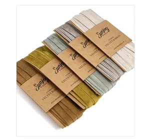 Close-up of multi-color velvet ribbons in 5-yard rolls with cardstock packaging