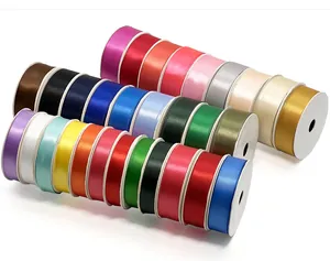 Close-up of assorted colorful satin ribbon rolls for decorative gift wrapping and DIY crafts
