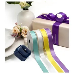 Various colors of smooth satin ribbon spools ideal for luxury gift box wrapping and crafts