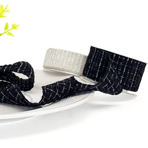 Elegant tweed ribbon with silver thread for gift packaging, accessories, and DIY crafts.