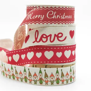 Stapel 25mm bedruckte Baumwollbänder mit Weihnachts- und Herzmustern