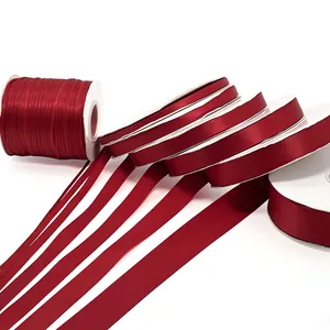 Assorted burgundy satin ribbons in multiple widths for gift wrapping and wedding decor