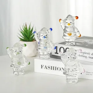 Set of four handcrafted clear crystal Santa Claus figurines with colorful accents