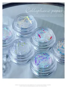 Six jars of iridescent laser cellophane shards for holographic nail art decoration