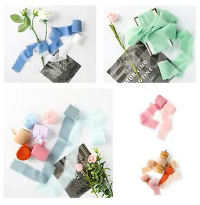 Detailed view of assorted pearl chiffon ribbons with frayed edges for gift wrapping