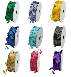 Multiple colors of embossed leaf ribbons on white spools for decoration.