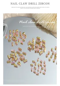 Funkelnde rosa Zirkon-Nagelcharms in verschiedenen Formen wie Marquise und Tropfen