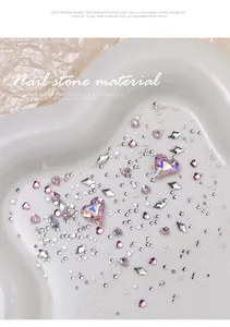 Detailed view of sparkling pink crooked heart gems and K9 crystal nail rhinestones