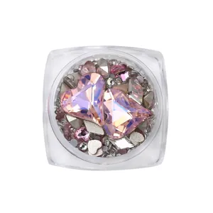 Set of pink heart-shaped K9 crystal nail art rhinestones in a clear square jar