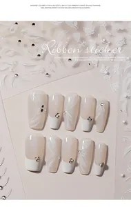 Close-up of 3D embossed nail stickers with ribbon, flower, and crystal diamond designs.