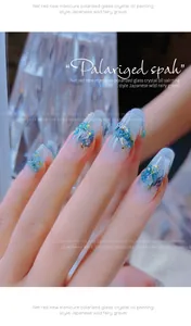 Close-up of Japanese-style blue polarized crystal crushed stones on manicured nails
