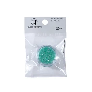 Irregular teal aurora crystal stones in a pot for professional 3D nail art decoration