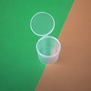 Close-up detail of a transparent round PP plastic box with an integrated flip-top lid