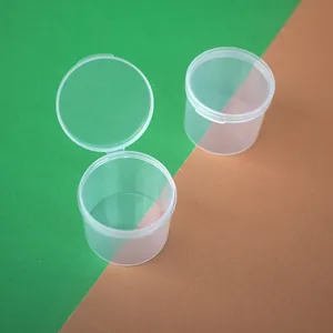 Detail showing the hinged flip-top lid of a transparent round PP plastic storage box