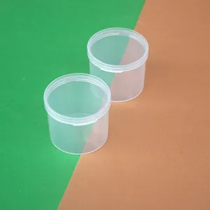 Close-up detail of high-transparency round PP plastic containers with integrated flip-top lids