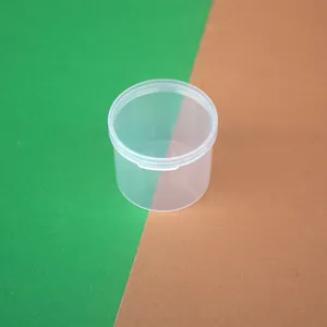 Macro detail of high-transparency round PP plastic container with integrated flip-top lid