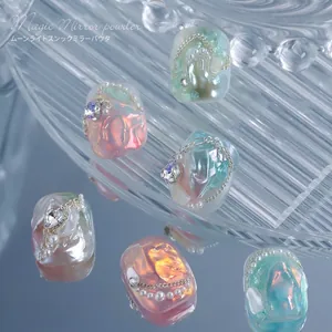 Aurora solid chrome nail powder with iridescent mirror effect and pearl decorations.