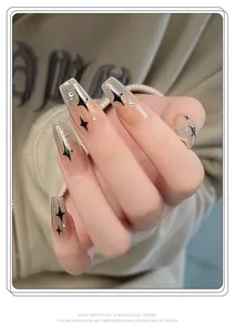 Detailed view of 3D starburst nail stickers with silver glitter and black stars