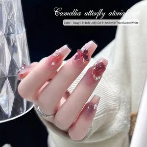 Elegant camellia flower and butterfly nail art accessories kit with gold chains and pearls