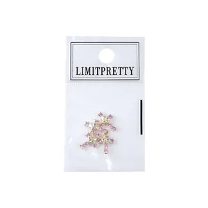 Charm's ongle crâne punk vintage avec strass roses sous emballage de protection