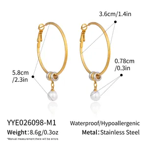 Detailed view of gold stainless steel hoop earrings with pearl pendant and dimensions